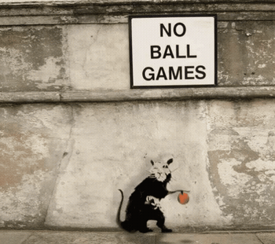 A Rat Is Holding A Ball Under A No Ball Games Sign GIF