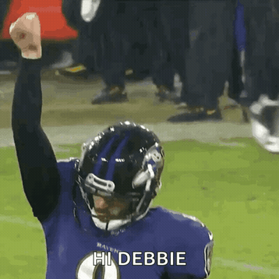A Ravens Football Player Is Celebrating With His Fist In The Air And Says Hi Debbie GIF