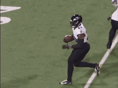 A Ravens Hat Is Sitting In Front Of A Large Explosion GIF
