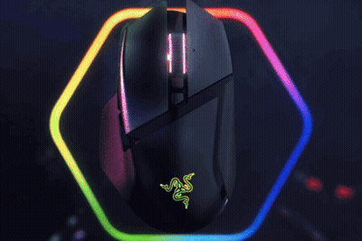 A Razer Mouse Is Surrounded By A Rainbow Of Lights GIF
