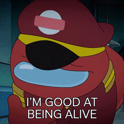 A Red Among Us Character Says " I 'M Good At Being Alive " While Wearing A Red Hat GIF