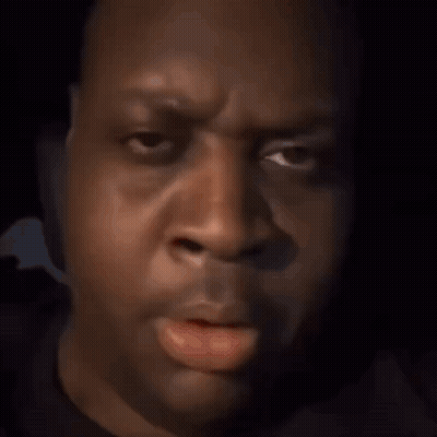 A Red Among Us Character With His Finger On His Mouth GIF