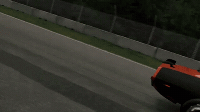 A Red And Black Dodge Car Is Driving Down A Race Track GIF