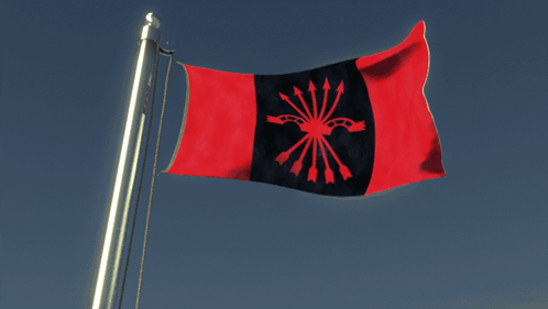 A Red And Black Flag With Arrows On It Flies In The Wind GIF