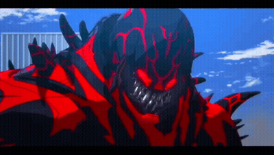 A Red And Black Monster With Sharp Teeth Is Standing In Front Of A Building GIF