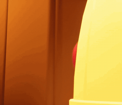 A Red And Blue Balloon Is Being Thrown Into A Yellow Object GIF