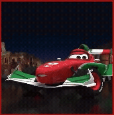 A Red And Green Racing Car With The Number 6 On The Side GIF
