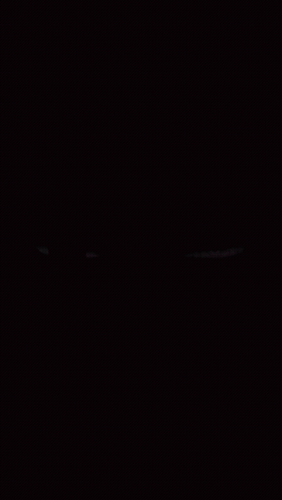 A Red And Purple Eye On A Black Background GIF