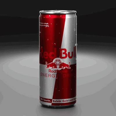 A Red And Silver Can Of Red Bull Energy Drink On A Black Background GIF