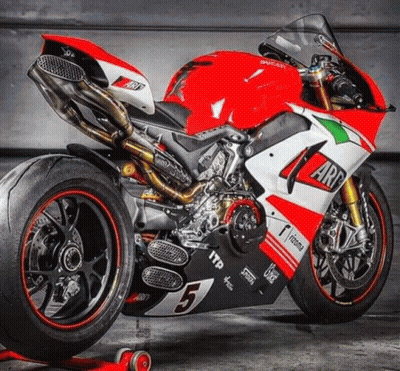 A Red And White Ducati Motorcycle With The Number 5 GIF