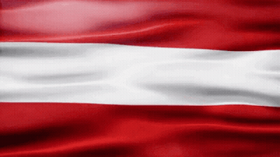 A Red And White Flag Is Waving In The Wind .. GIF