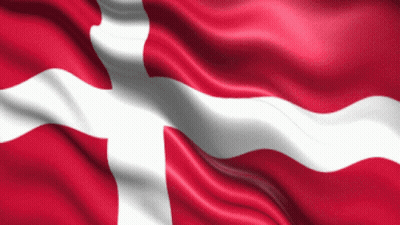 A Red And White Flag With A Cross On It Is Waving In The Wind GIF