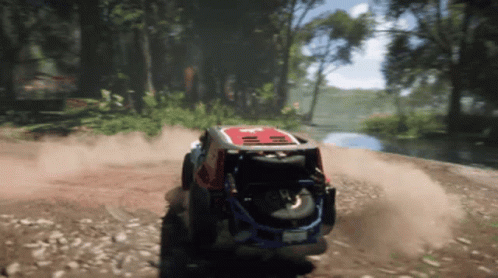 A Red And White Jeep Is Driving On A Dirt Road GIF