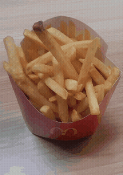 A Red And White Mcdonald 'S Container Of French Fries GIF