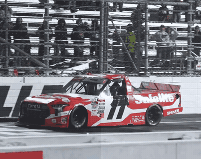 A Red And White Race Car That Says Safelite On The Side GIF