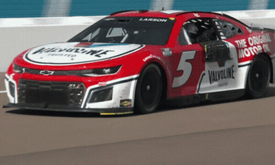 A Red And White Race Car With The Number 5 On The Side GIF