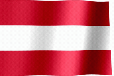 A Red And White Striped Flag Is Waving In The Wind GIF
