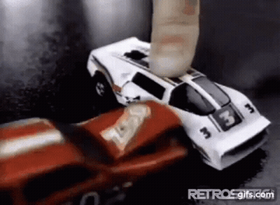 A Red And White Toy Car Is Being Smashed By A Finger . GIF