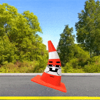 A Red And White Traffic Cone With A Face On It GIF