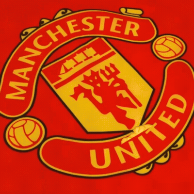 A Red And Yellow Manchester United Logo With A Finger Pointing At It GIF