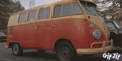 A Red And Yellow Van Is Parked In A Parking Lot With The Words Gif Jif On The Bottom GIF