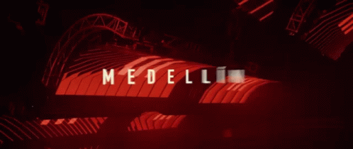 A Red Background With The Word Medellin Written On It GIF
