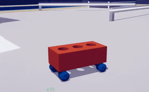 A Red Brick With Three Holes In It Is Laying On A White Surface GIF