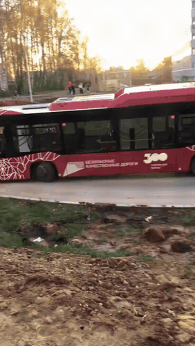 A Red Bus That Says 300 On The Side Of It GIF