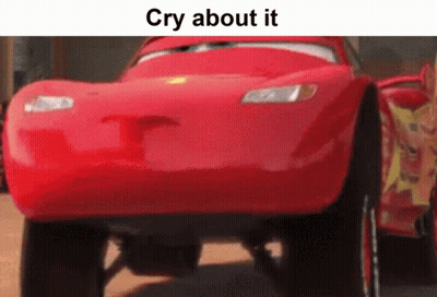 A Red Car From The Movie Cars Is Driving Down A Road . GIF