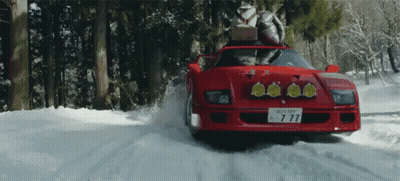 A Red Car With A License Plate That Has The Number 77 On It GIF