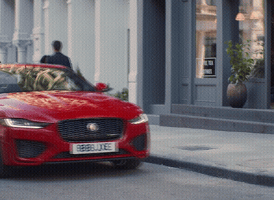 A Red Car With A License Plate That Says Rebellxee GIF