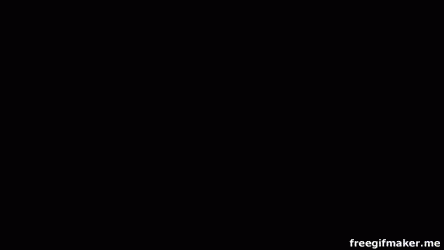 A Red Car With A Yellow Eagle On The Side Is Spinning On A Circle . GIF