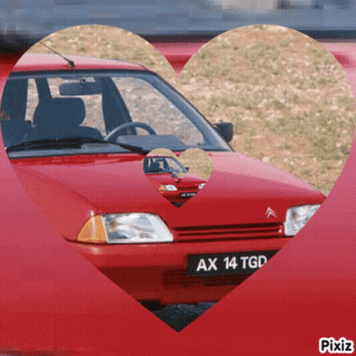 A Red Car With Ax 14 Tgd On The License Plate GIF