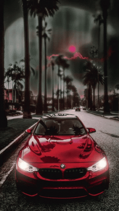 A Red Car With The Word Bmw On The Front GIF