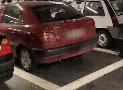 A Red Citroen Car Parked In A Parking Lot GIF