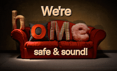 A Red Couch With The Words " We 'Re Home Safe & Sound " On It GIF