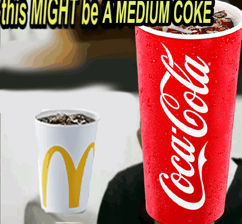 A Red Cup Of Coca Cola Next To A White Cup GIF
