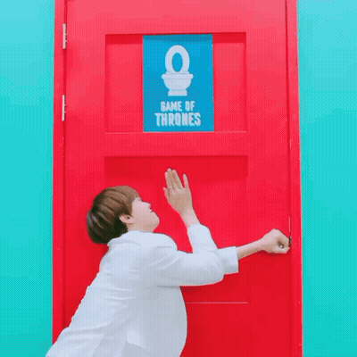 A Red Door With A Blue Sign That Says Game Of Thrones On It GIF