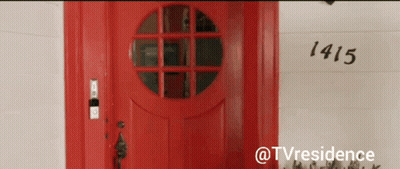 A Red Door With The Number 1415 On The Wall GIF