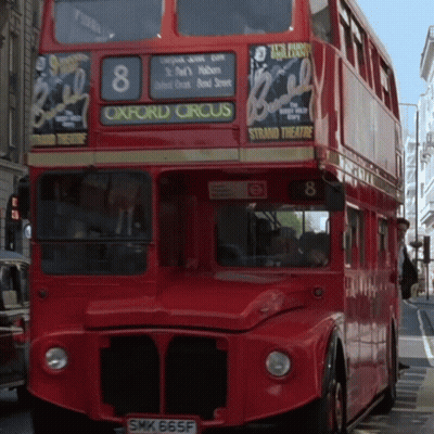 A Red Double Decker Bus Has The Number 8 On The Front GIF