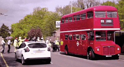 A Red Double Decker Bus With The Number 69 On The Side GIF