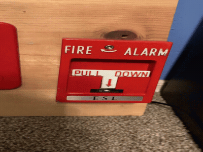 A Red Fire Alarm That Says Pull Down GIF