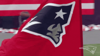 A Red Flag With A Patriots Logo On It Is Waving In The Wind GIF
