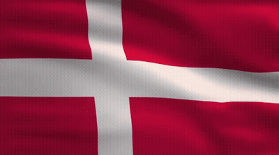 A Red Flag With A White Cross On It GIF