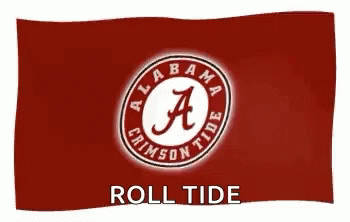 A Red Flag With The Alabama Crimson Tide Logo On It Is Waving In The Wind . GIF