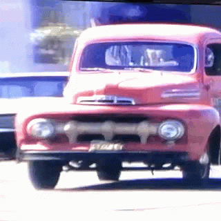 A Red Ford Truck With A License Plate That Says ' E7a46 ' GIF