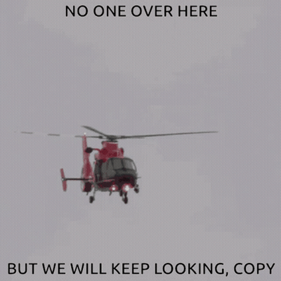 A Red Helicopter Is Flying In The Sky With The Words " No One Over Here But We Will Keep Looking Copy " GIF