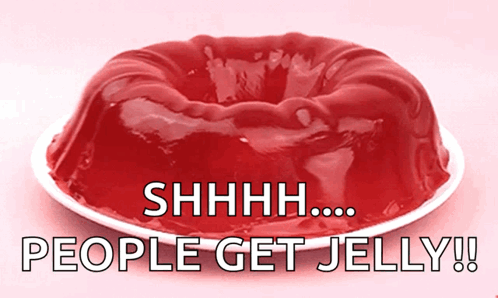 A Red Jelly Cake On A White Plate With The Words " People Get Jelly " Below It GIF