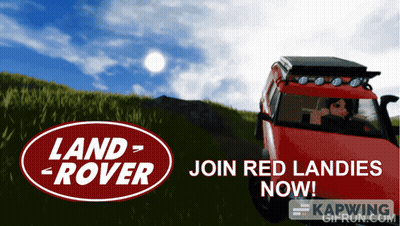 A Red Land Rover Is On A Grassy Hill GIF