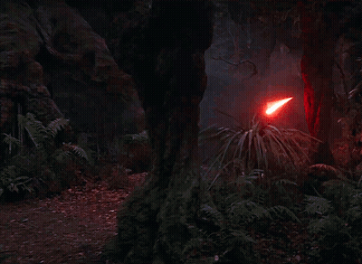 A Red Light Beam Is Coming Out Of A Red Object In The Dark . GIF